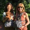 Bernadette and Patty holding their Cockapoo puppies
